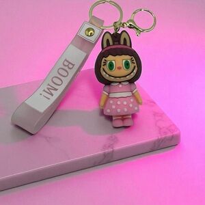 Cute Monster Girl Keychain Bag Charm with Pink Dress & “BOOM!” Strap